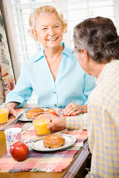istock Mature couple eating breakfast. 144284820