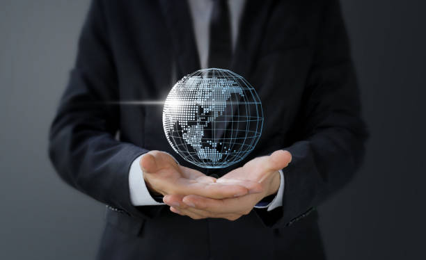 istock Businessman holding digital world map in hand 1442849061