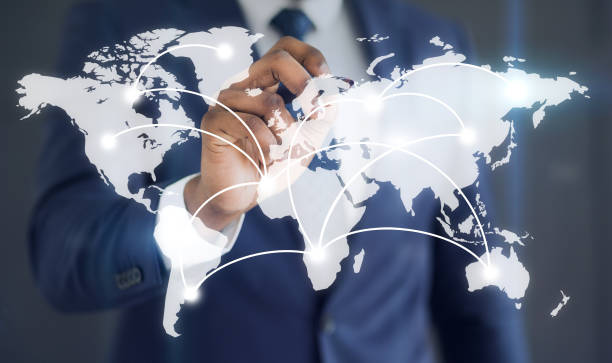 istock Businessman showing with connections on the word map 1442849074