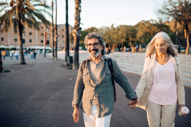 istock Happy mature couple on a journey enjoying walking 1442852275