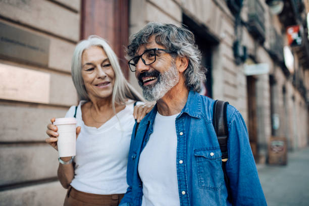 istock Happy mature couple on a journey enjoying walking 1442852310