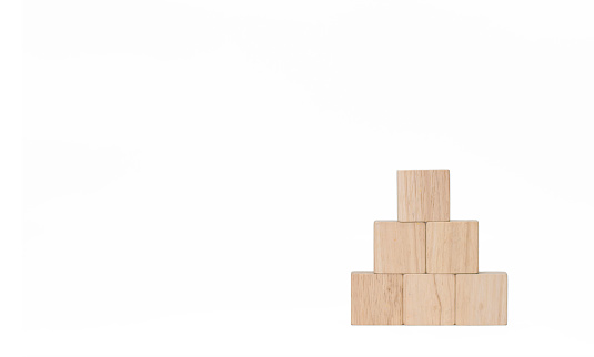 Empty wooden blocks arranged in the shape of a pyramid. Ideas icons can be included, such as business ideas, insurance tasks, or health concepts. white background photos Do not hesitate if you want to convey the message.