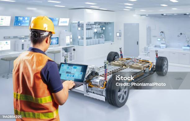Asian Engineer With Ev Car Battery Cells Module In Laboratory Stock Photo - Download Image Now