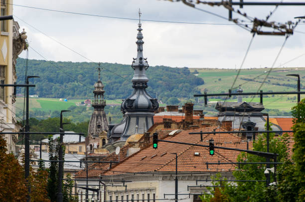 Cluj-Napoca, Romania - September 17, 2022: The beautifully ornamented roofs of some historical buildings, in Cluj-Napoca.