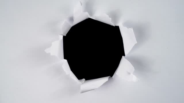Round torn paper stop motion for copy space. Ripped paper animation for video effect overlay