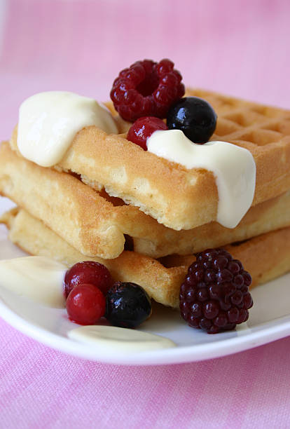 istock hot waffles with berries and vanilla sauce 144285753