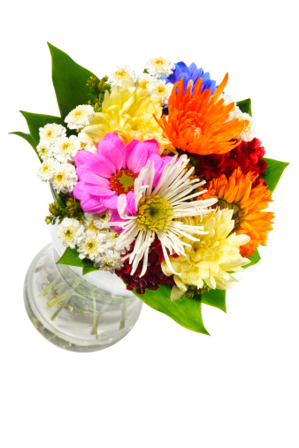 Beautiful colourful bouquet of flowers in a transparent glass vase. 