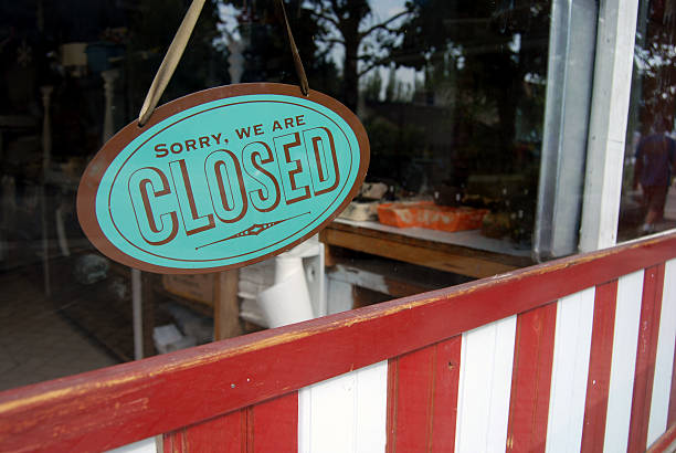 A blue vintage closed shop sign stock photo