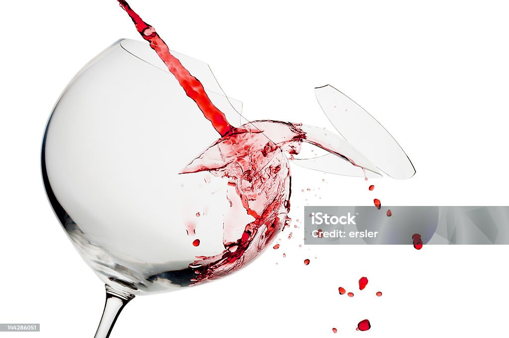 crack view of broken wine glass  getting filled with red wine Breaking Stock Photo