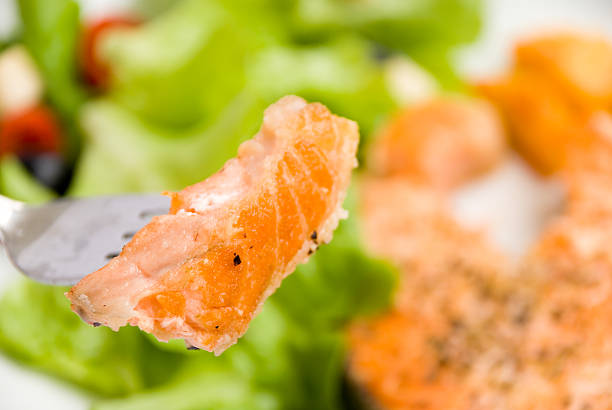 istock Gourmet grilled Salmon with Herbs-Crust and Salad 144286085