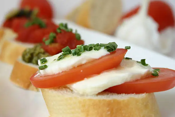 tomato-mozzarella on a slice of baguette