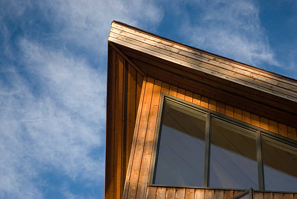 istock Cottage roof against blue sky 144286192