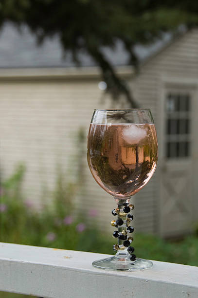 Wine filled glass stock photo