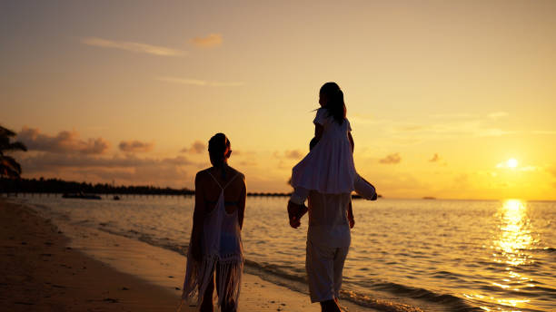 istock Family With Child Together On Beach 1442869136