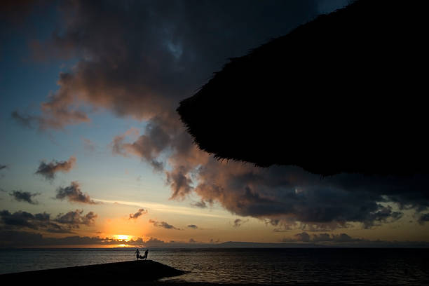 istock Morning on the shore two man carring with bag 144286986