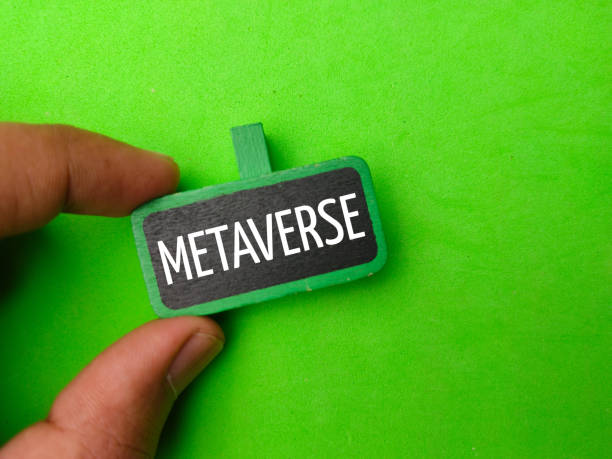 istock A hand holding a colored wooden board with the word METAVERSE. 1442872875