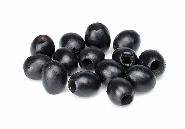istock Black olives scattered on a white background 144287389
