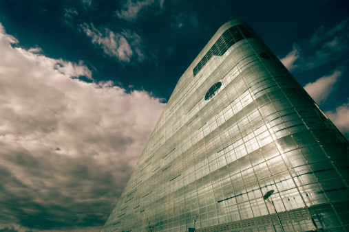 A Central building in Manchester, UK set amongst a rolling cloud scape. 