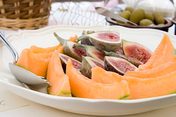 Plate of sliced fruit stock photo
