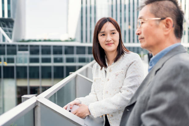 istock Two business people talking about business 1442880080