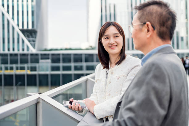 istock Two business people talking about business 1442880085