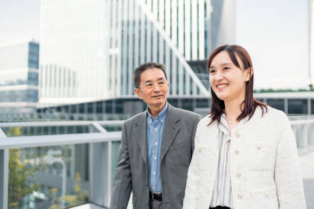 istock Two business people walking and talking about the business 1442880102