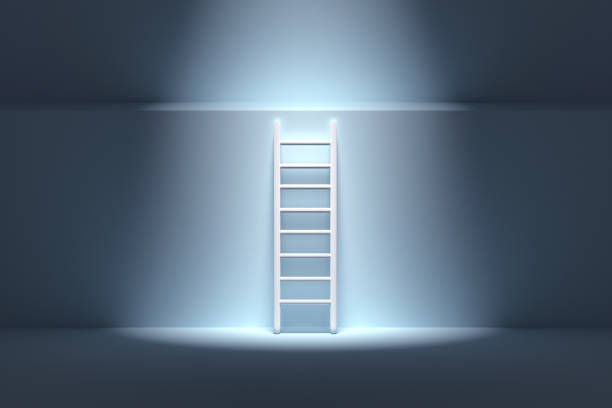 istock Ladder with light standing next to blue wall, climb up concept 1442881035
