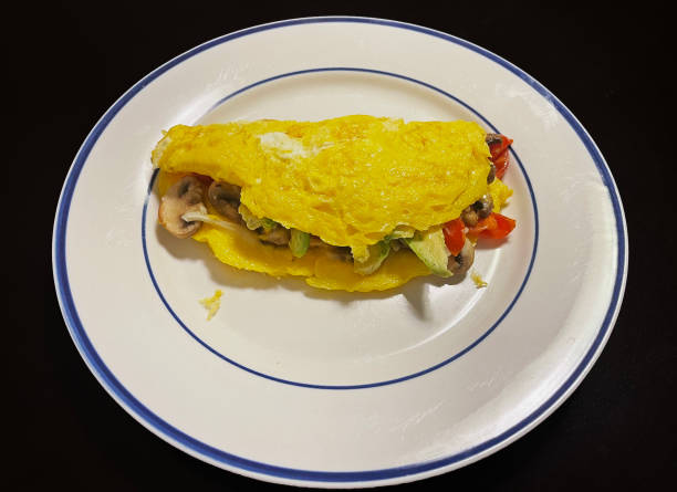 istock Tomato, Mushroom, Cheese, and Avocado Omelette 1442883007
