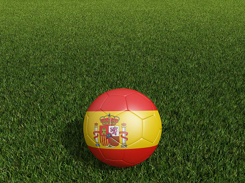 Football in Spain flag  on  green grass. 3d rendering