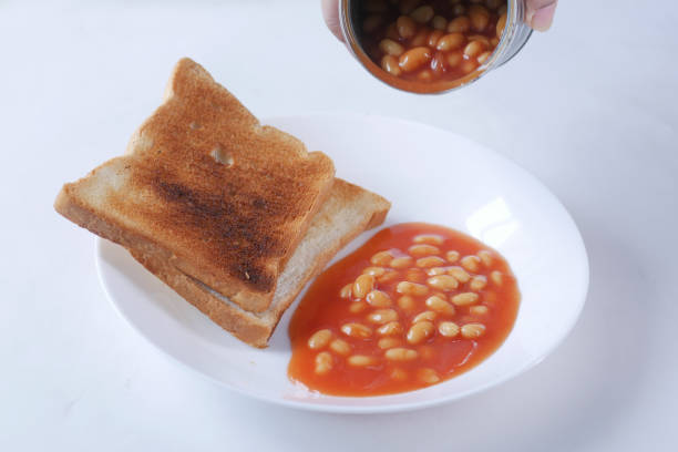 istock preserved beans pouring from a tin container on a plate 1442884233