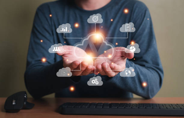 istock Selective focus at the icon with hand of human that holding cloud icon while who using internet and personal cloud storage to keep information and payment data, upload over the internet. 1442884334