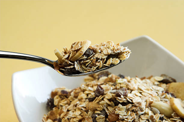 istock Spoon of meusli above a bowl 144288521