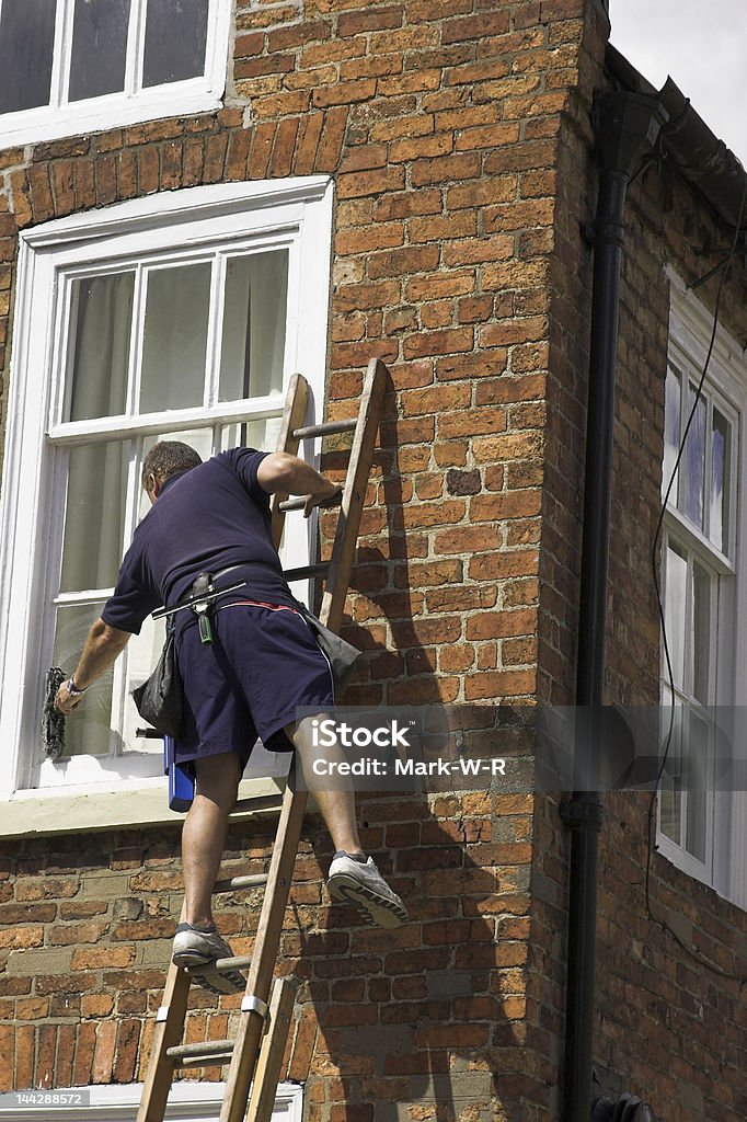 Man On A Ladder Stock Photo - Download Image Now - Ladder, Window Washer,  Danger - iStock