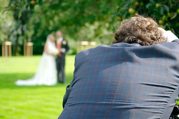 istock A wedding photographer at work taking a picture 144288710