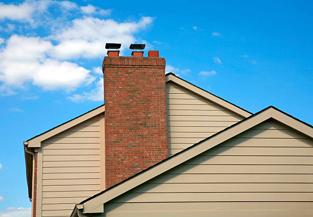 Side of House Side of House Against a Blue Sky chimney photos stock pictures, royalty-free photos & images