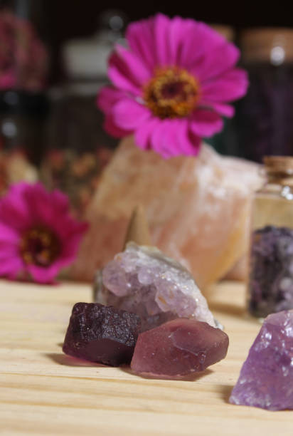 istock Amethyst Crystals With Flowers and Incense Cones on Meditation Table 1442891183