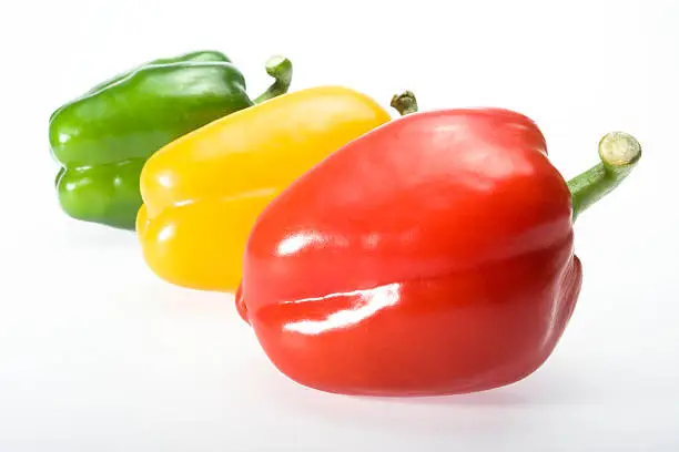 close up of green red and yellow bellpeppers