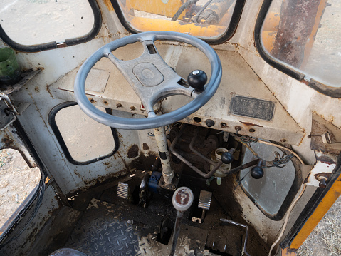 nostalgic rusty tractor isolated on white