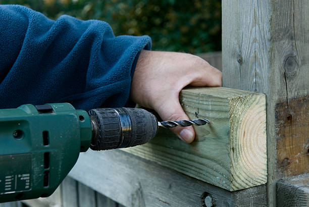 DIY craftsman is drilling stock photo