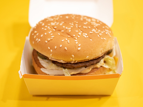 Big Mac Hamburger Close-up on Yellow Background