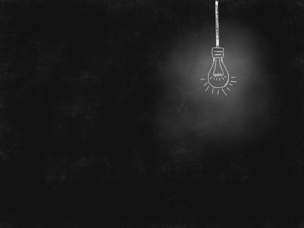 istock White lightbulb line drawing on black background illustration 1442894246