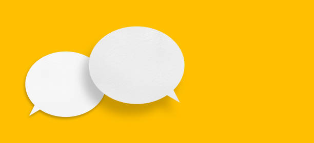 istock White paper in speech bubble shape set against yellow background. 1442894413