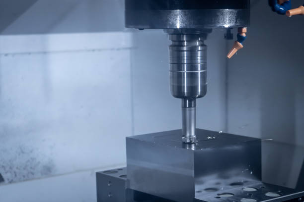 istock CNC machine tool cutting raw material in factory 1442897476