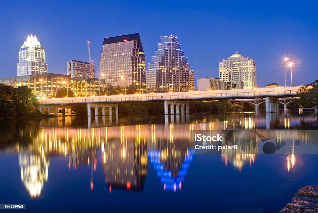 Austin Texas City Skyline at Night with Reflections Austin Texas city skyline from Riverside, overlooking Town Lake Architecture Stock Photo