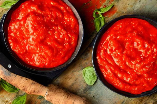istock Top view of small bowls of fresh tomato paste 1442902240