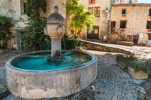 Hot spring water. Lion head fountain pouring water. Thermalism. Caldas de Reis, Spain