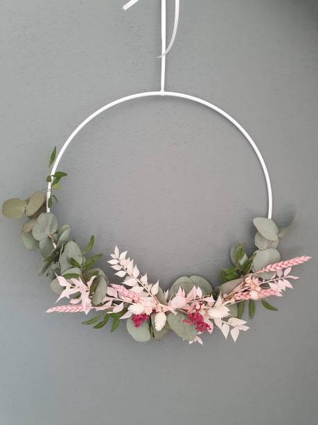 istock Vertical shot of decorative wreath hanging on gra 1442904115