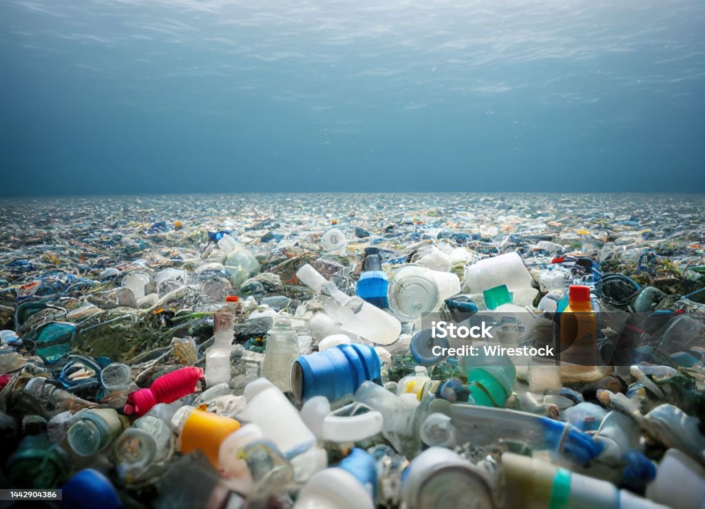 Devestating shot of plastic waste in the ocean. Water Pollution. A devestating shot of plastic waste in the ocean. Water Pollution. Plastic Stock Photo