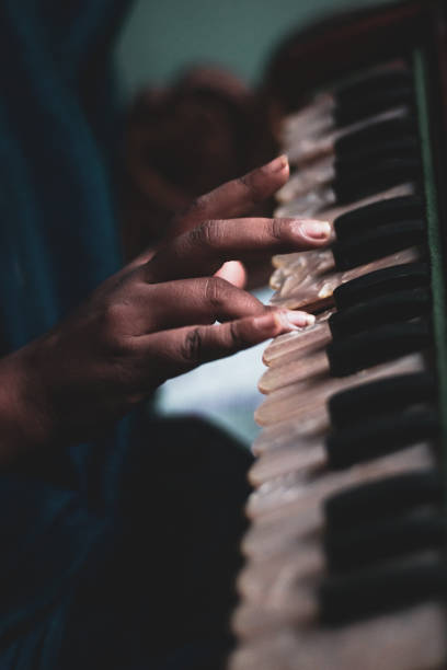 istock Person playing the vintage piano 1442909074