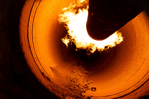 A closeup of a rotary kiln for clinker production in a cement plant